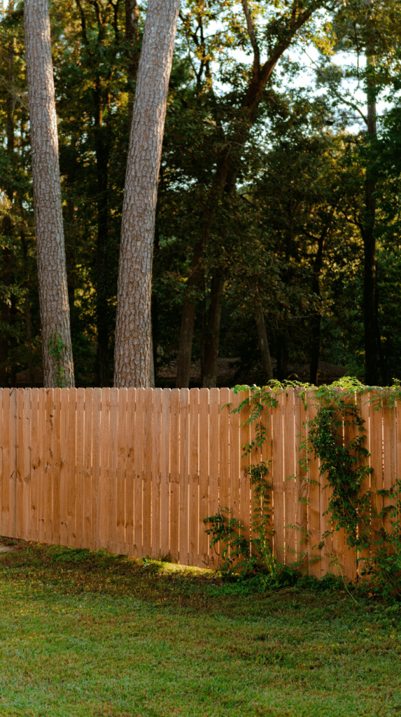 Modern horizontal wood slat fencing providing backyard privacy.
