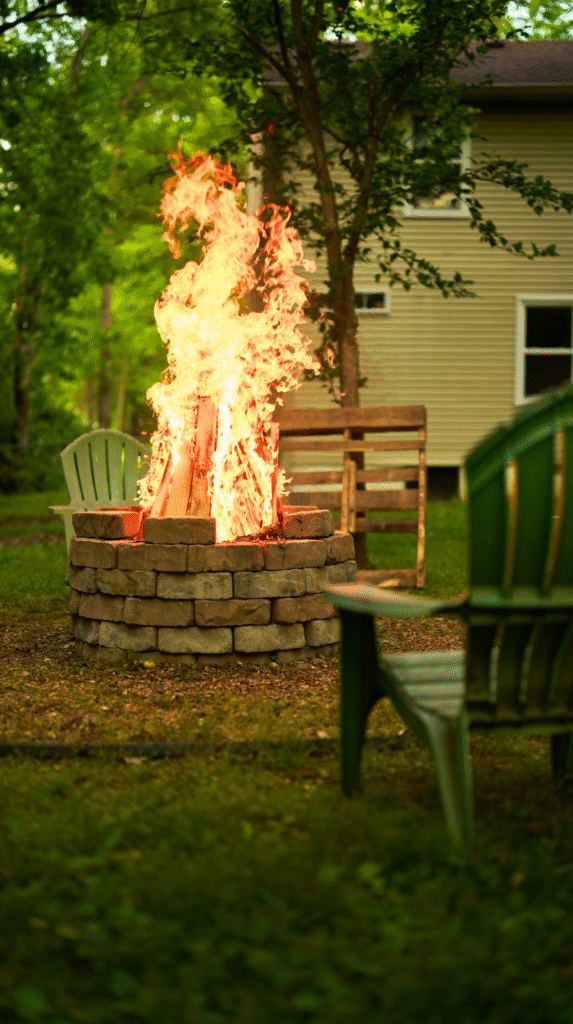 A private backyard fire pit area with warm ambient lighting for evenings.
