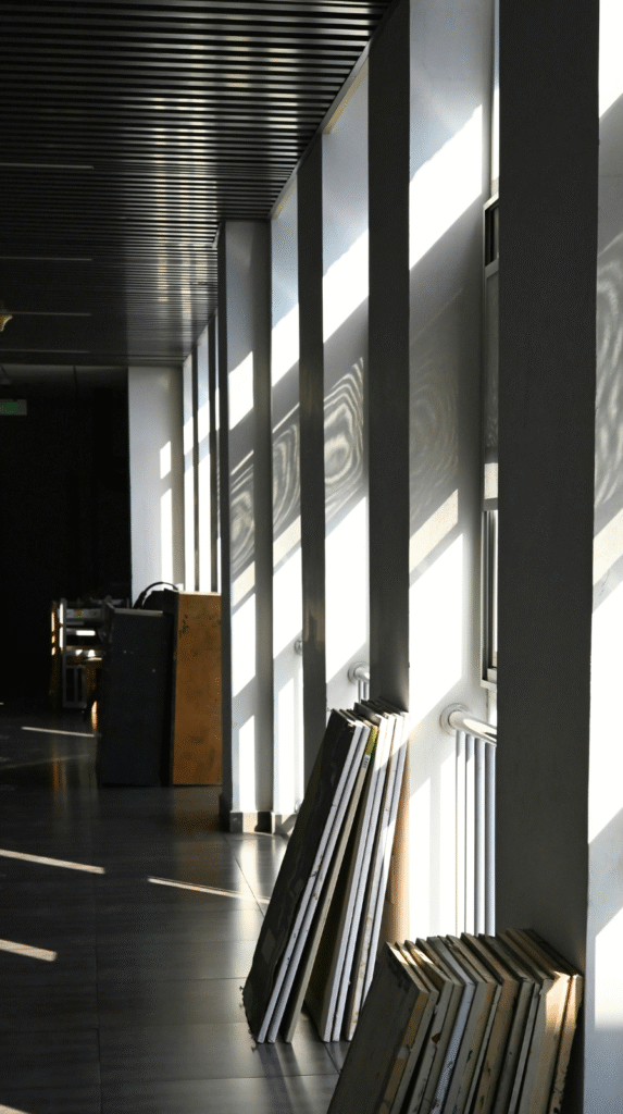 Strategic lighting in a dark organic modern decor room featuring warm accent lamps and moody shadow play.
