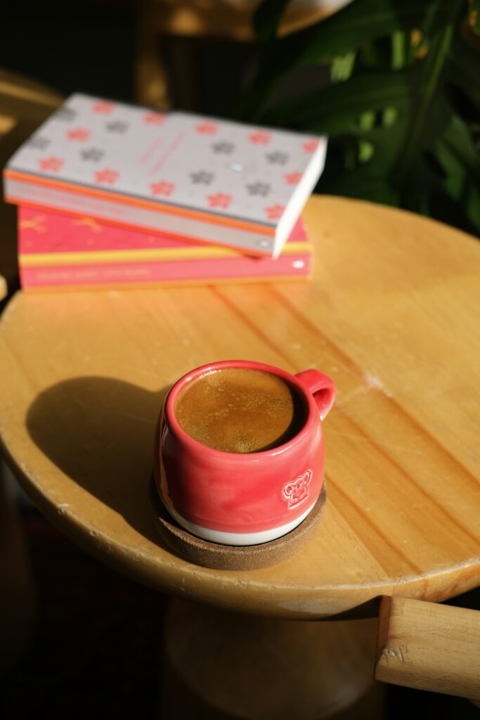 A curated coffee table with a book and tea, demonstrating the 5 steps to a quiet luxury living room
