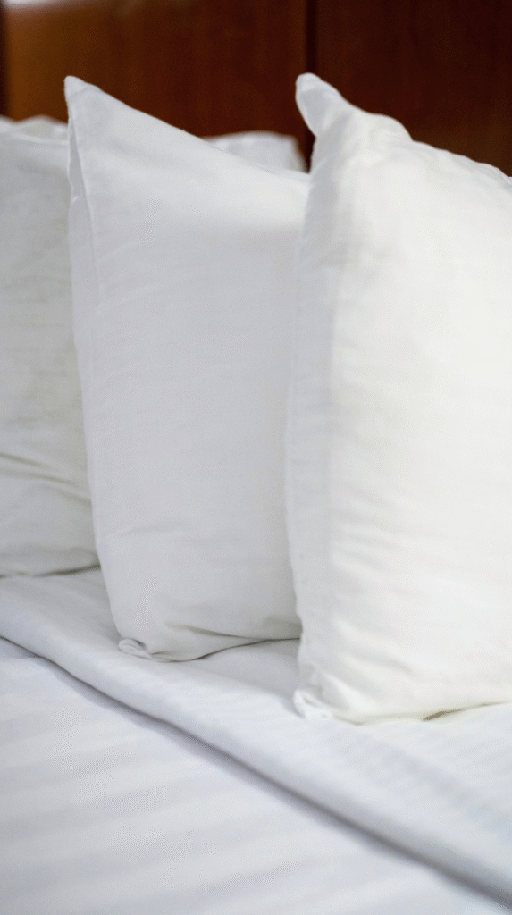 Close up of linen fabrics and natural wood, promoting sensory wellness in an anti-inflammatory home
