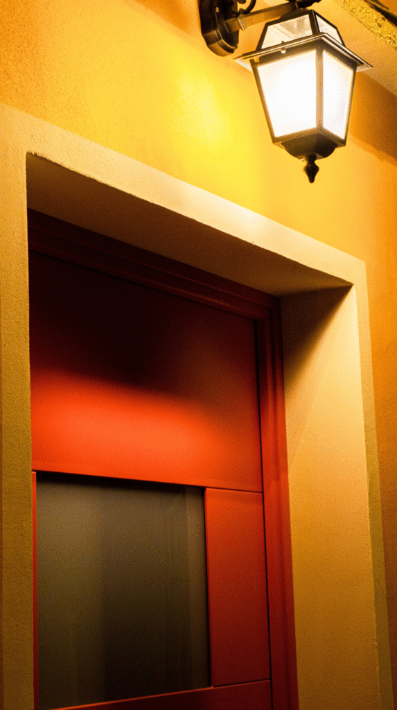 Layered lighting hierarchy and warm bedside lamps for circadian health.