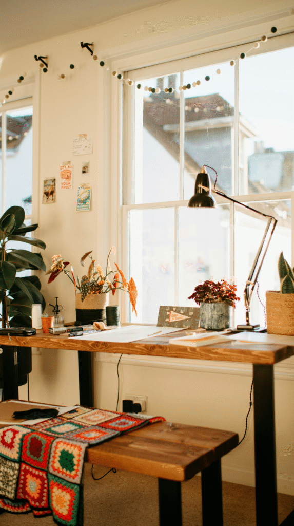 A window-facing desk setup maximizing natural light for a calm workspace design
