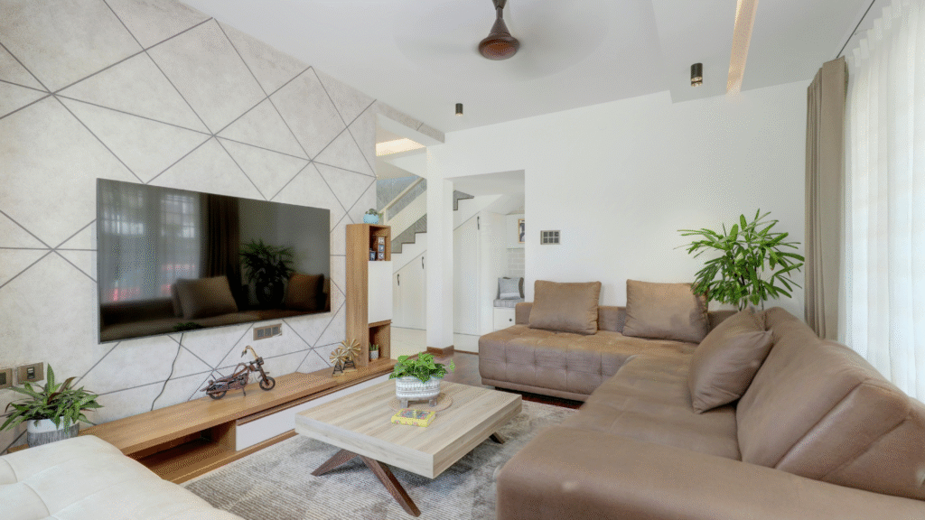 A serene living room featuring the rooted home aesthetic with warm soil and sun tones, limewash walls, and organic linen furniture.
